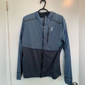 On Running mens Weather Jacket. Blue.